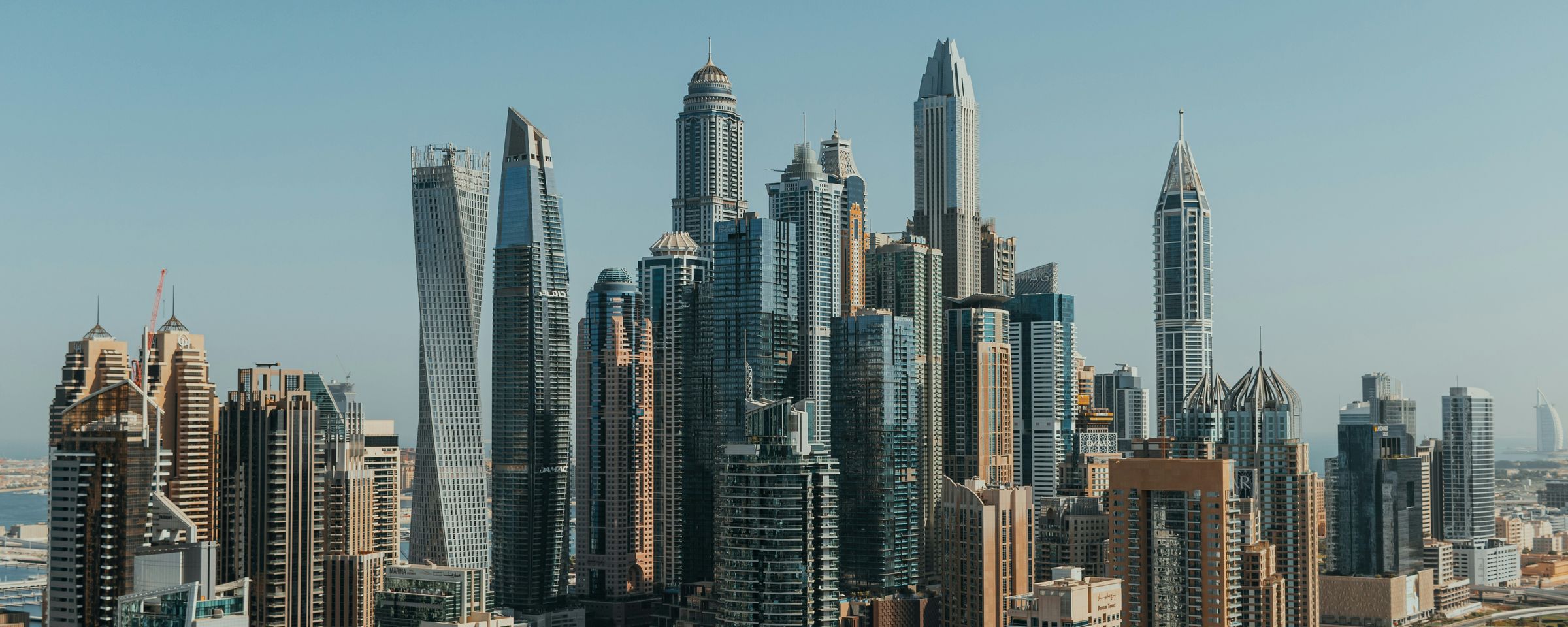 Dubai Marina skyscrapers under a clear blue sky